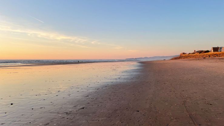 the beach and ocean at sunset on the Oregon Coast